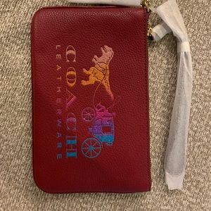 COACH Rexy Carriage wristlet, deep red